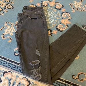 Guess black power skinny low rise jeans
